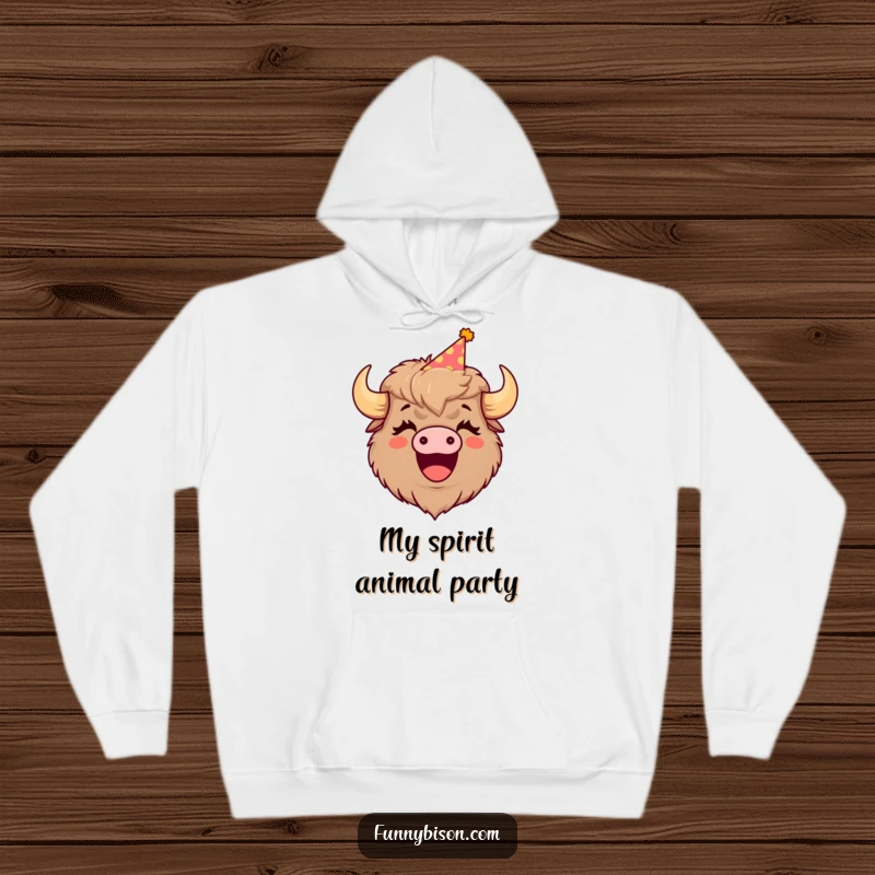 Funny hoodie featuring a cute bison donning a party hat, its mouth open in a hearty, contagious laugh, perfect for cozy laughs.