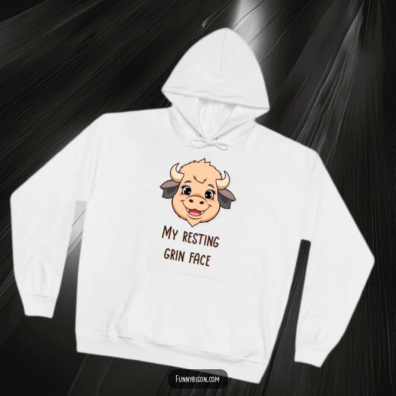 Funny hoodie featuring a stylized bison head with over-the-top happy eyes and a massive, wide grin, perfect for cozy cheer.