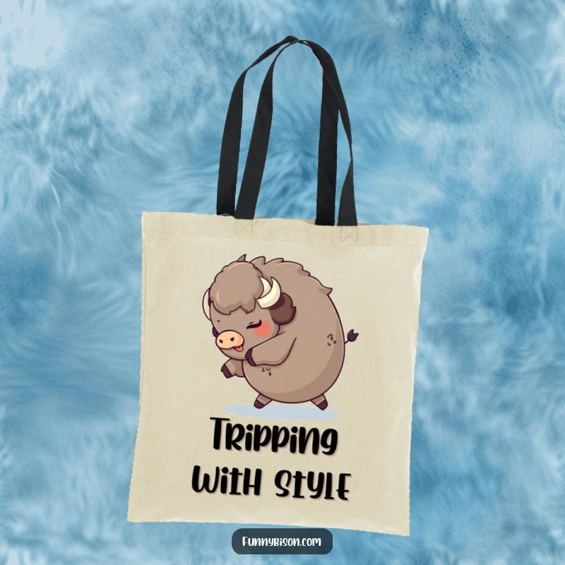 Funny round bison tripping playfully and landing on its fluffy rear, showcased on a durable and humorous tote bag.